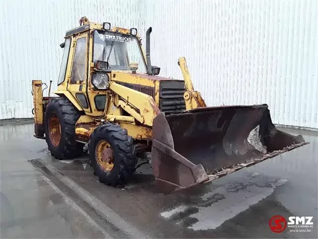 1990 Caterpillar 428 Laad-graafcombinatie — photo 1 of 5