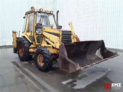 1990 Caterpillar 428 Laad-graafcombinatie — photo 1 of 5